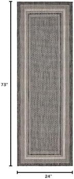 unique loom outdoor border collection area rug shown in use