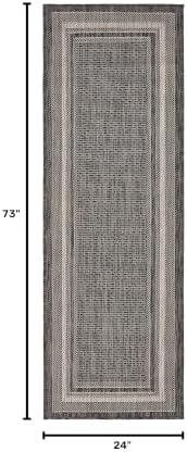 unique loom outdoor border collection area rug shown in use