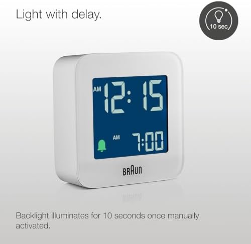 braun digital travel alarm clock with snooze, compact, close-up detail