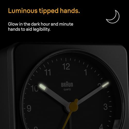 braun classic analogue alarm clock with snooze and shown in use