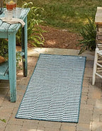 unique loom outdoor striped collection area rug shown in use