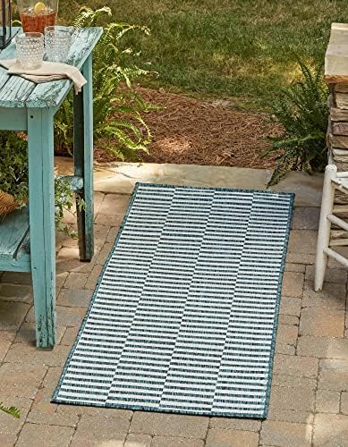 unique loom outdoor striped collection area rug shown in use