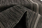 unique loom outdoor border collection area rug, front angle view