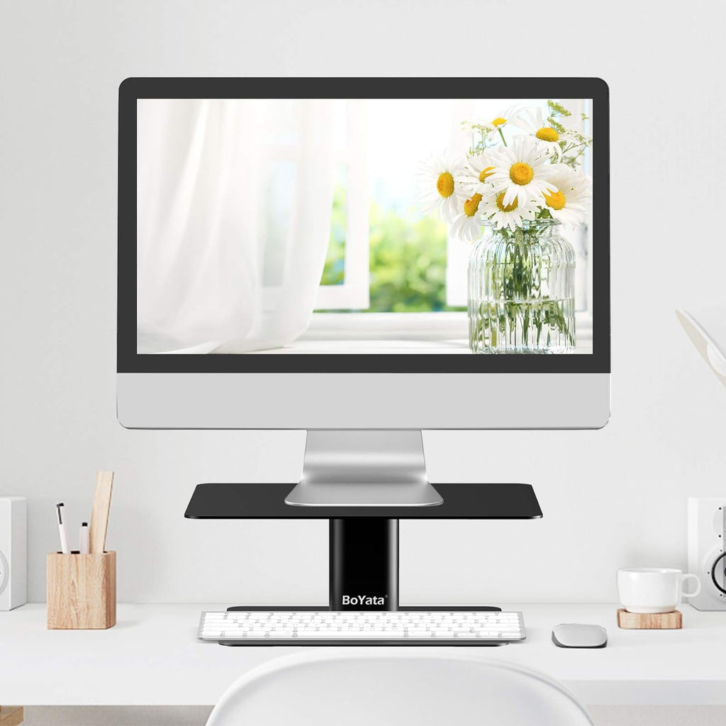 boyata monitor stand, adjustable height metal desktop riser shown in use