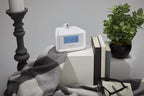 homedics dual alarm digital fm clock radio time on a desk or shelf