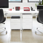 Poppin Mobile Mini Sittable Stow Rolling File Cabinet - White with Dark Gray Seat Cushion. Two Locking Drawers and One Key Lock. Two Keys Included. One Utility Drawer and One Hanging File Drawer