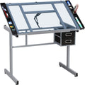 Yaheetech Glass Drafting Table with Storage, Adjustable Art Drawing Desk | Tempered glass top on a steel frame tilts 0-60° for drawing, tracing, or diamond art, plus two fabric drawers and side trays.