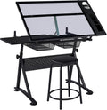 Yaheetech Adjustable Drafting Table & Stool, Tilting Glass Art Desk, Black | Tempered glass top tilts 0-40 degrees for drawing or tracing on a sturdy iron frame, with 2 mesh drawers for craft supplies.
