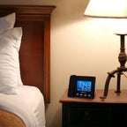 magnasonic projection alarm clock with am/fm radio, battery, front angle view