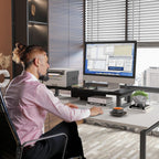 westree dual monitor stand riser, wood and steel shown in use