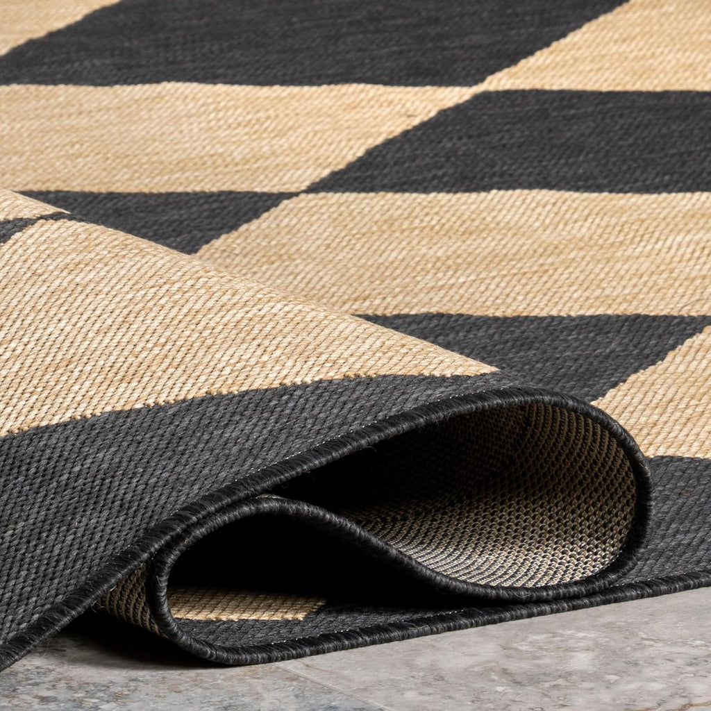 nuloom sabina dark grey trellis indoor/outdoor runner rug on a desk or shelf