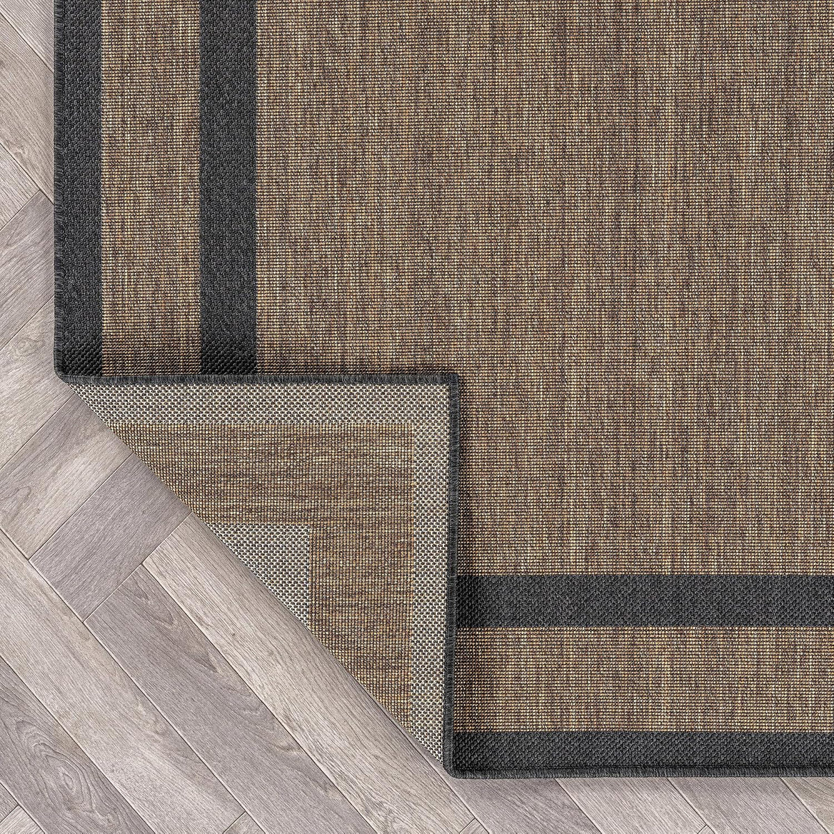 rugshop border jute-style indoor outdoor runner rug dark on a desk or shelf
